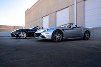 Silver 2016 Ferrari California T convertible with black accents and starburst rims.
