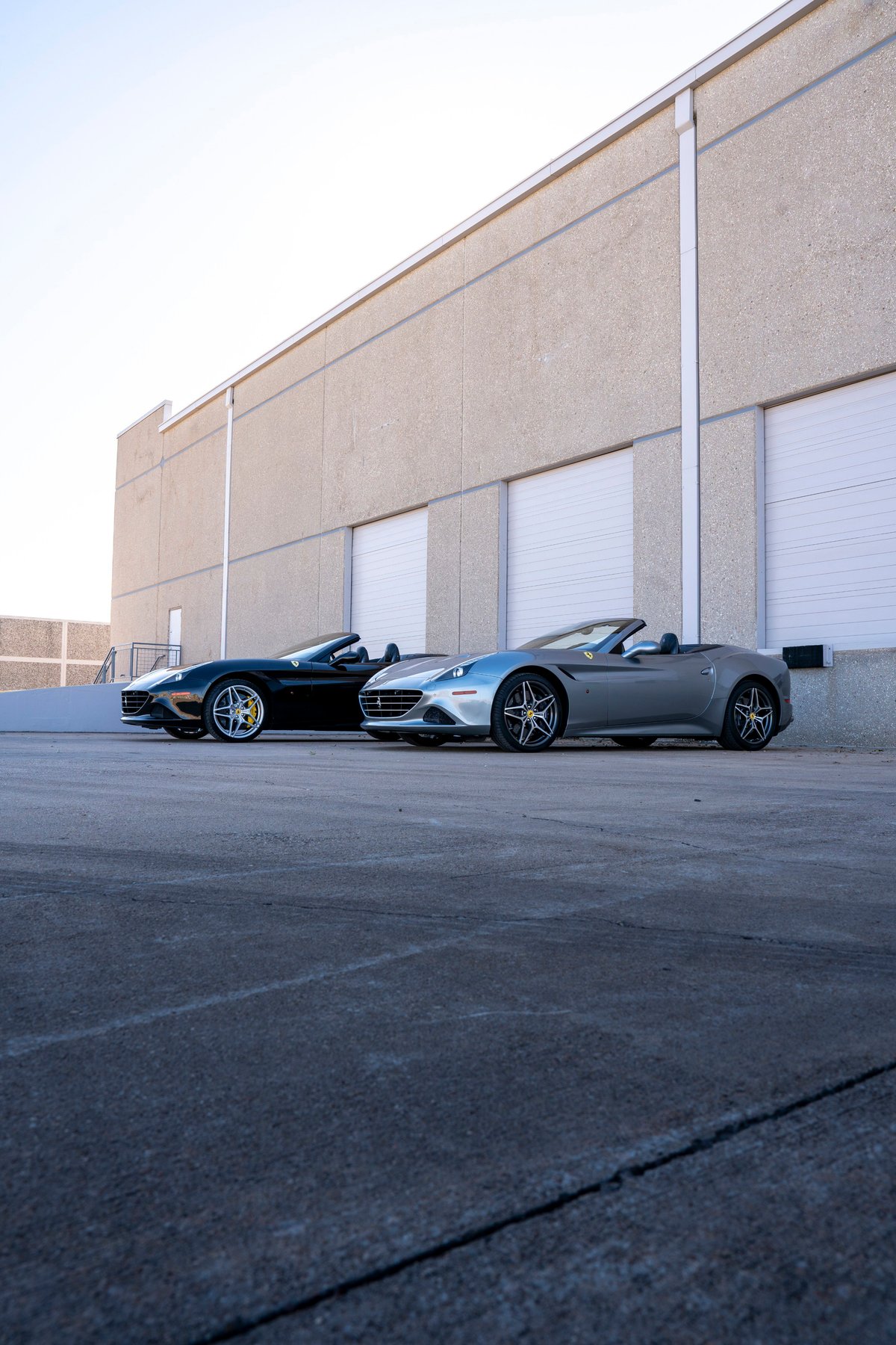 Silver 2016 Ferrari California T convertible with a black interior and multi-spoke alloy rims.