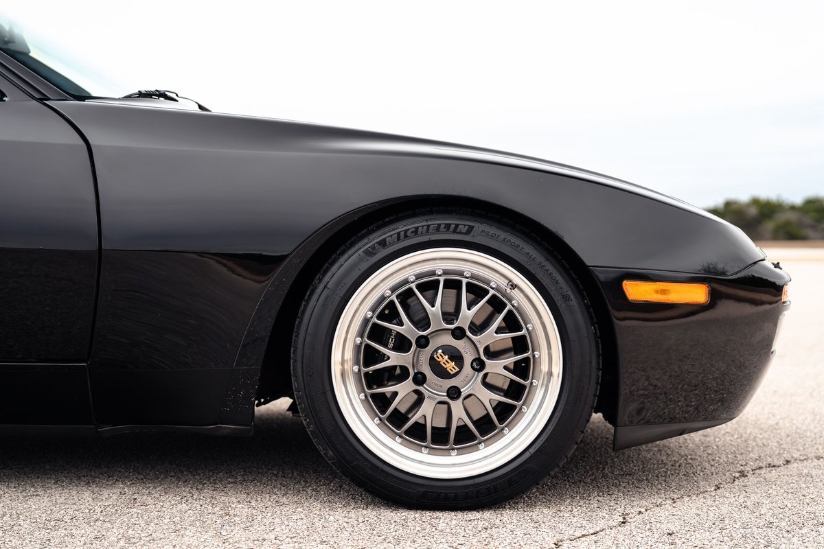 Black 1986 Porsche 944 Turbo front quarter panel with BBS rims.