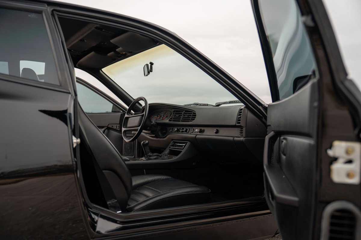1986 Porsche 944 Turbo interior: black leather seats, dashboard, steering wheel.