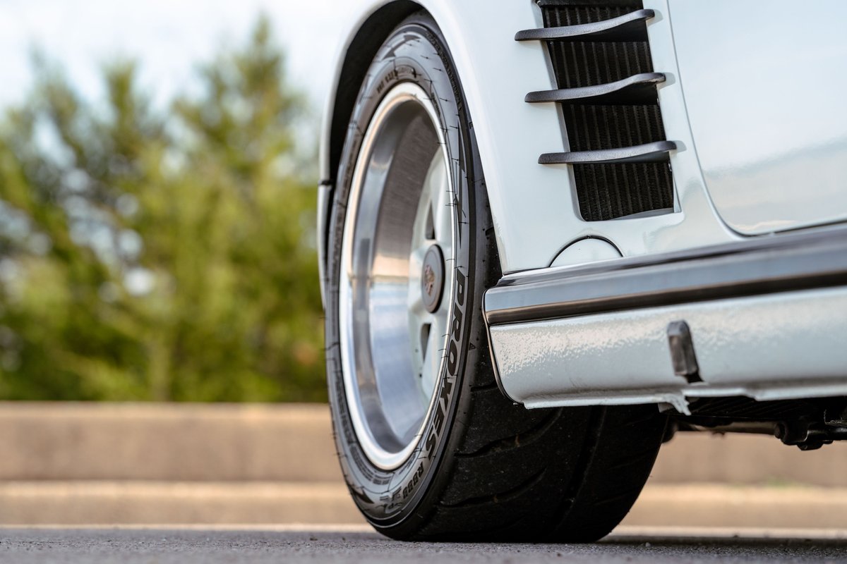 1988 Porsche 930 Turbo Slantnose rear wheel and fender detail, white paint.