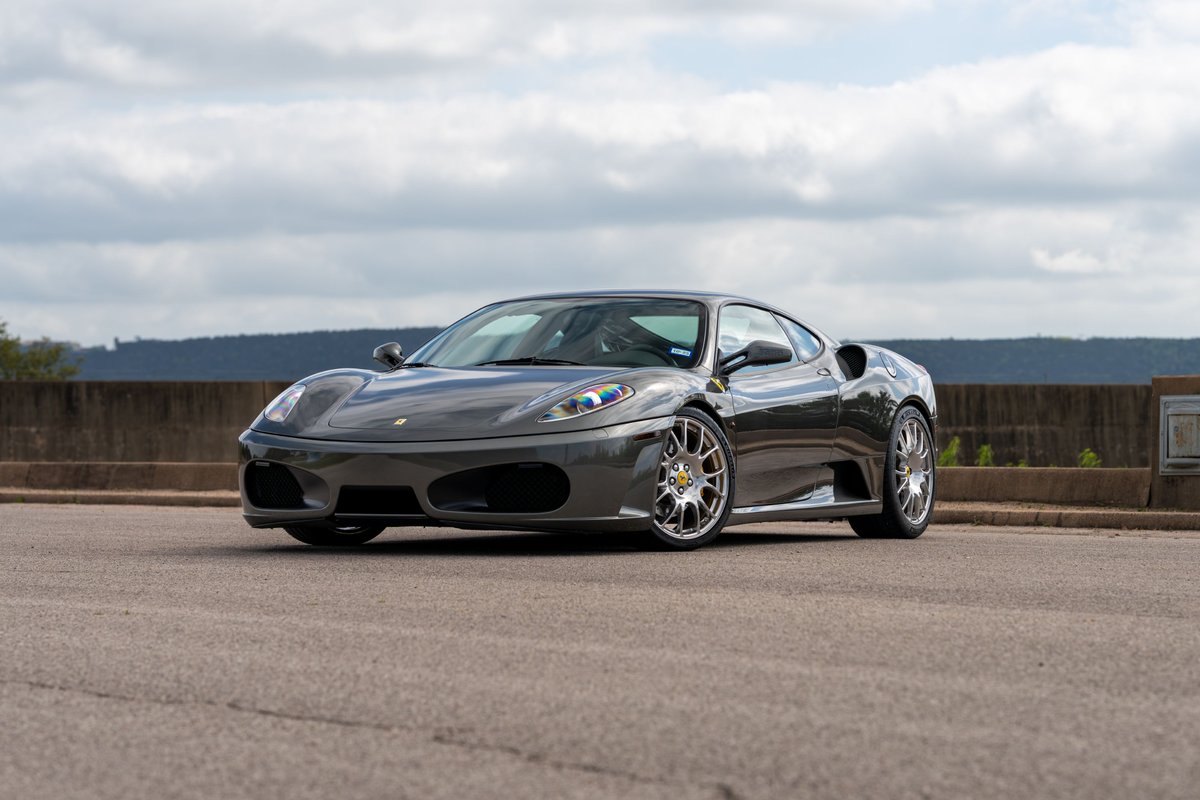 Grigio Silverstone 2007 Ferrari F430 6-speed with silver aftermarket rims.