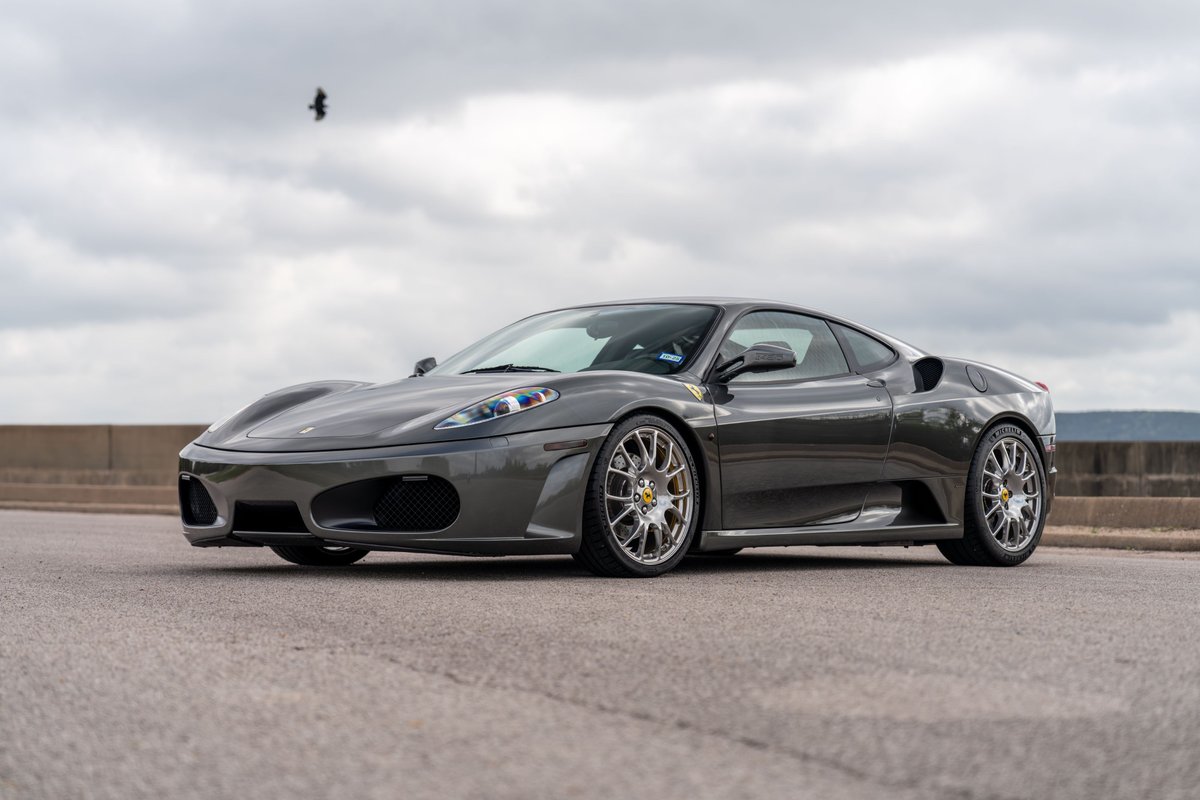 2007 Ferrari F430 coupe in Grigio Silverstone with grey finish and five-spoke rims.