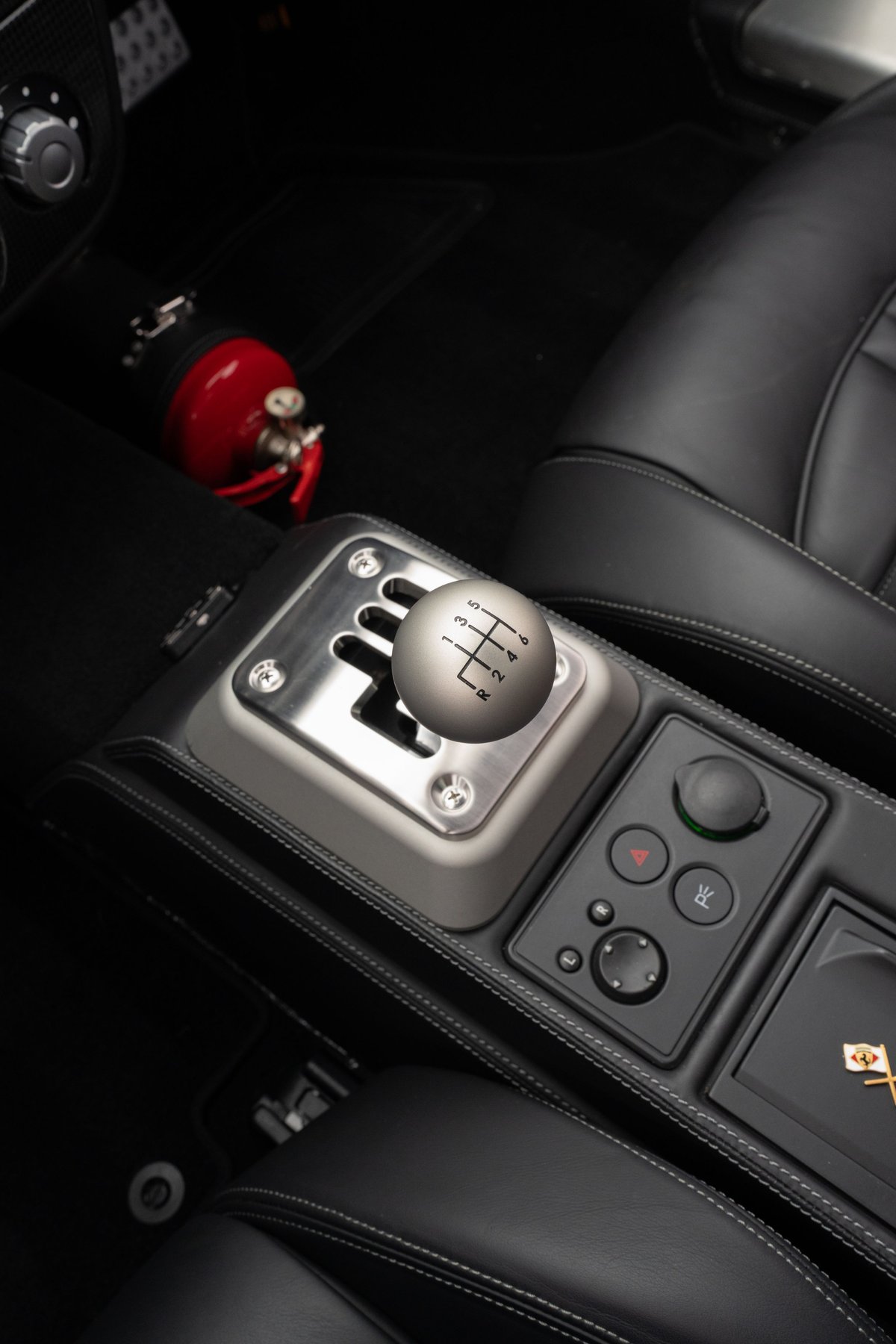 Grigio Silverstone 2007 Ferrari F430 6-speed manual gear shifter with chrome trim.