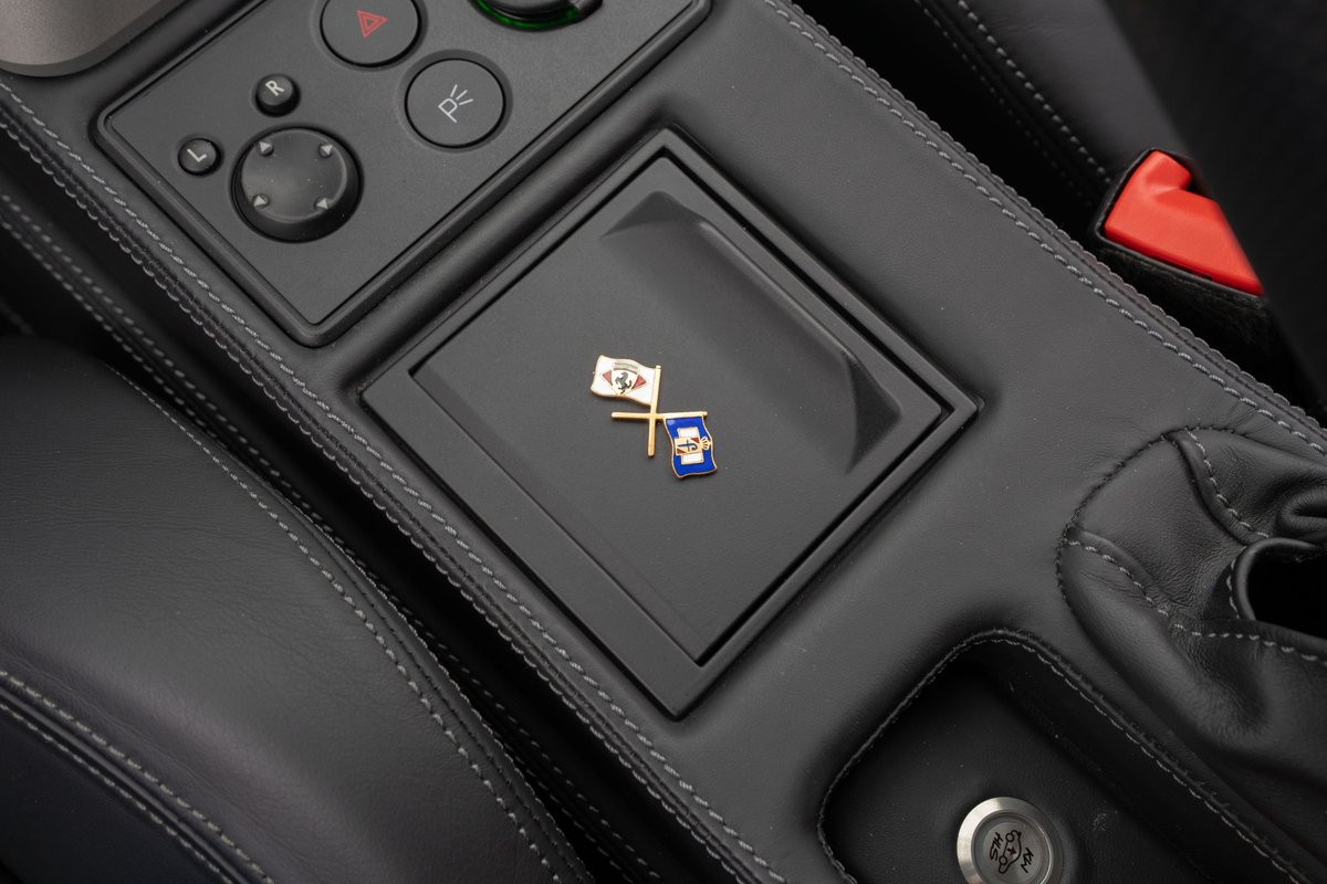 Close up of the Ferrari F430's center console with custom pins and stitching.