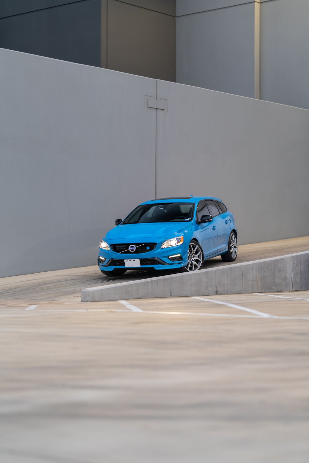 2015 Volvo V60 Polestar in Rebel Blue, with unique alloy rims and black trim.