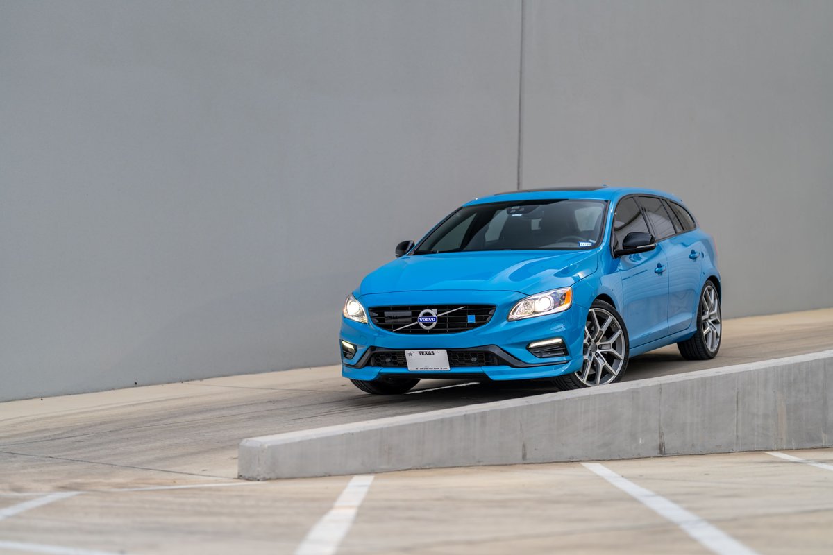 Rebel blue 2015 Volvo V60 Polestar on distinctive alloy rims with black trim accents.