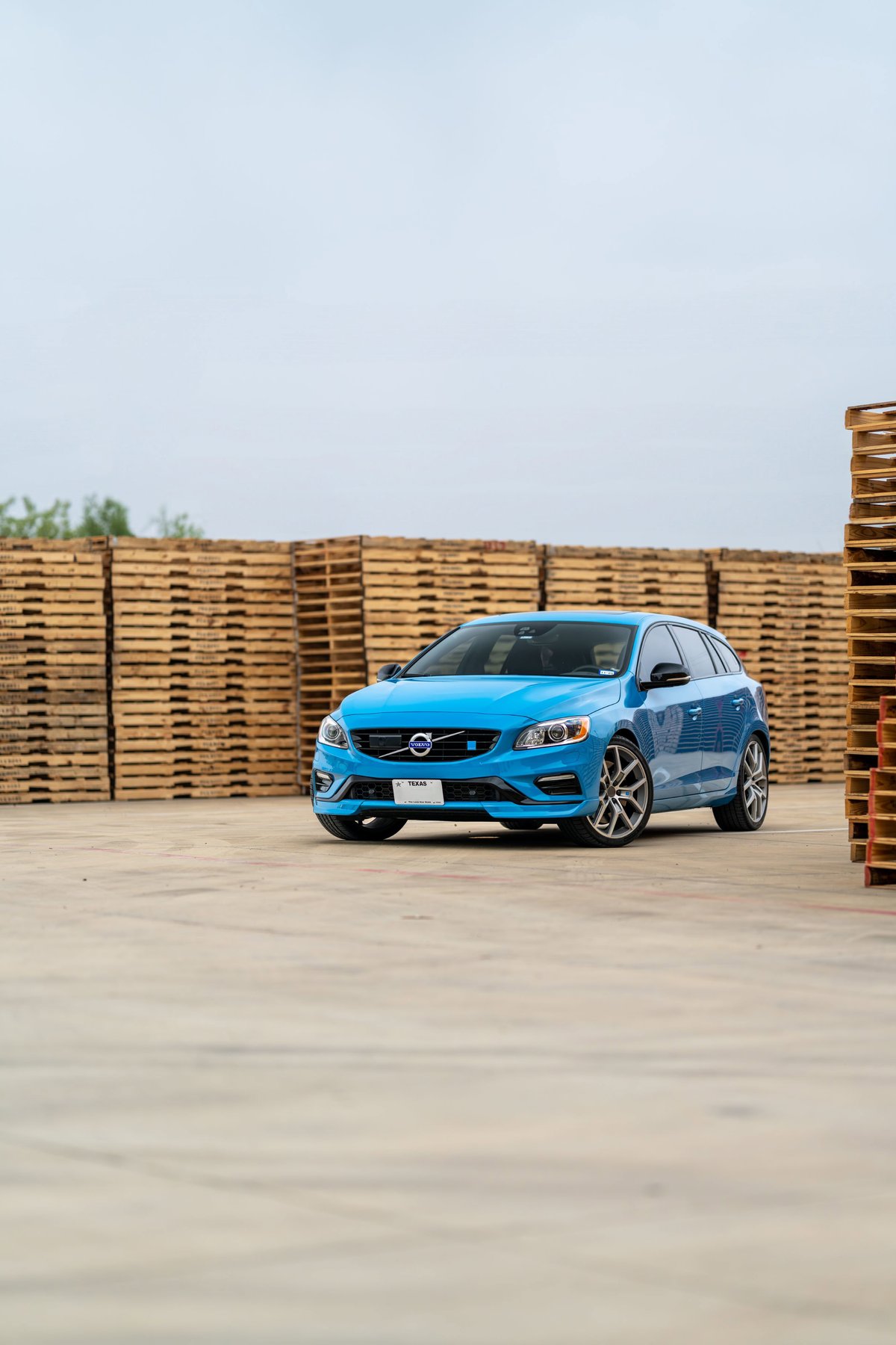 Rebel blue 2015 Volvo V60 Polestar with grey alloy rims and black trim.