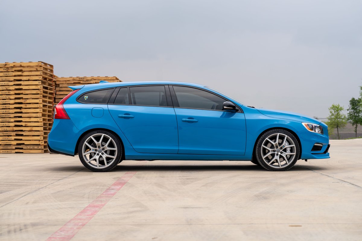 2015 Volvo V60 Polestar in Rebel Blue, side view, with performance rims.