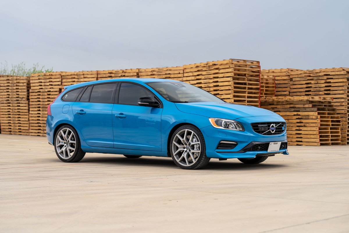 A Rebel Blue 2015 Volvo V60 Polestar with multi-spoke alloy rims and black trim accents.