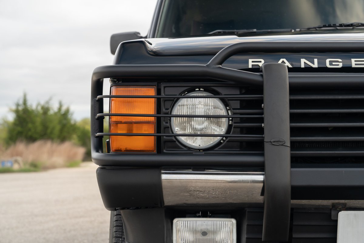 1994 Land Rover Range Rover County LWB front-right close-up with brush guard.