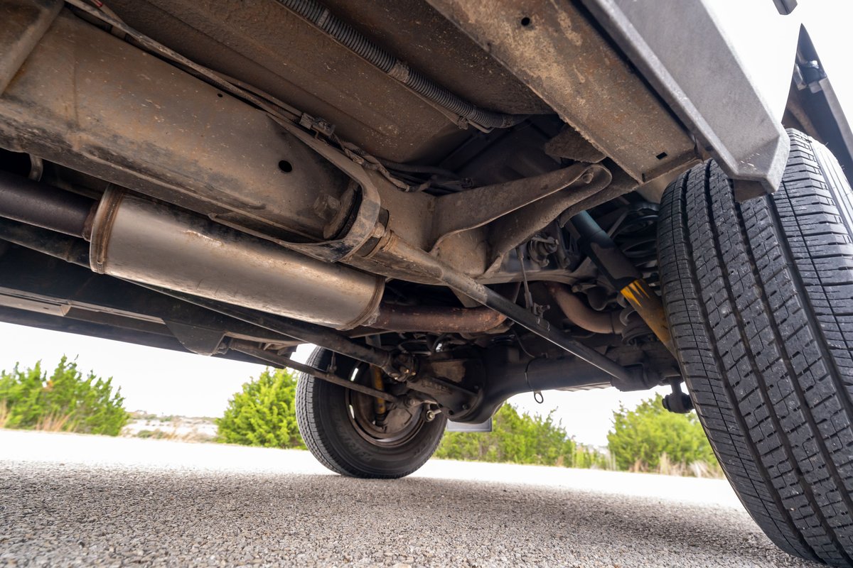 Underside of a 1994 Range Rover County LWB, showing the exhaust and rear suspension.