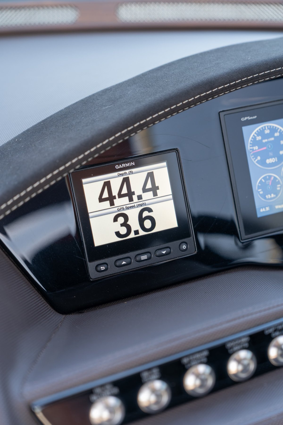 Close-up of Garmin GPS display on a 2018 Cobalt R7 Surf boat dashboard, showing 44.4 depth & 3.6 mph.