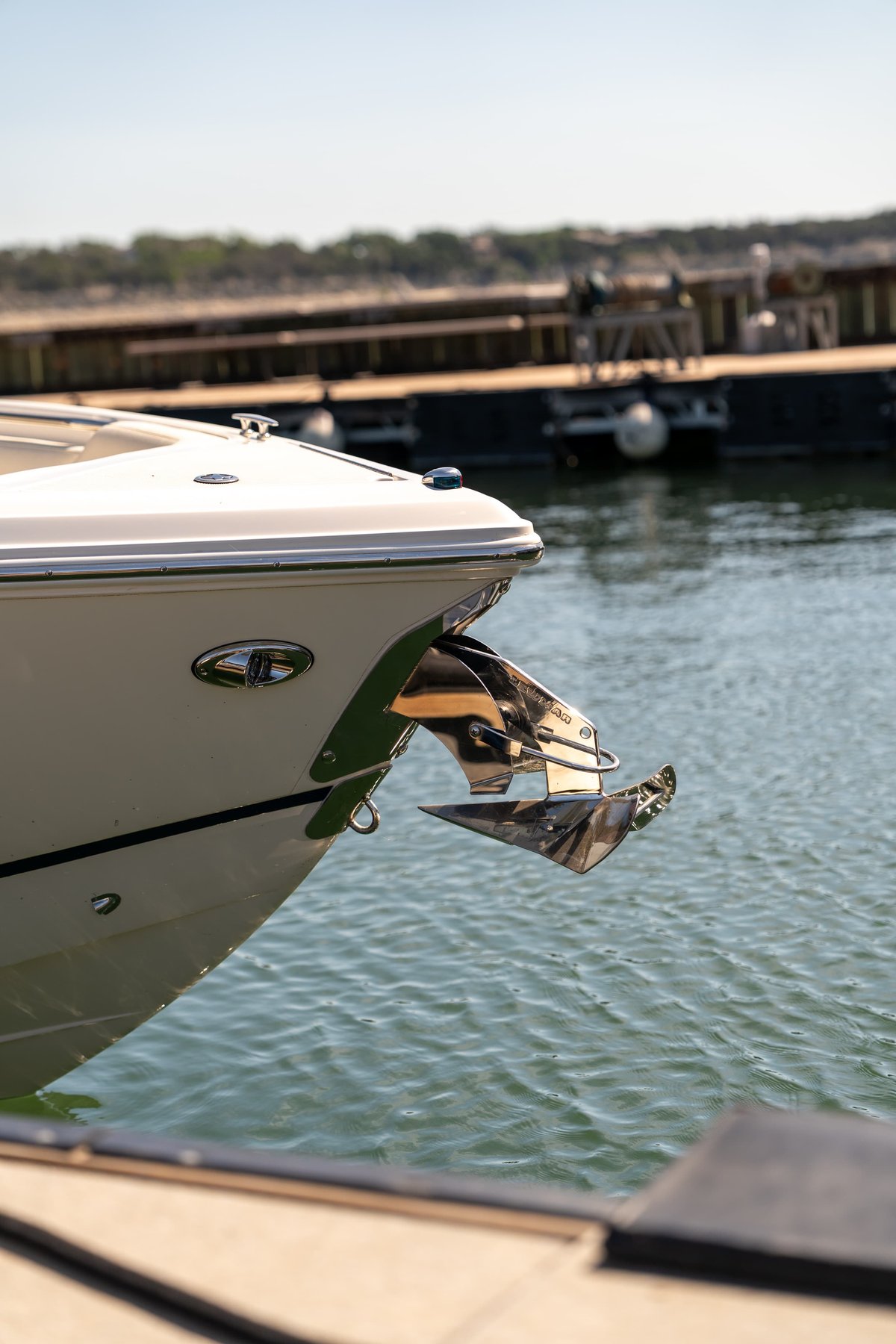 Cobalt R7 Surf bow with polished stainless steel anchor and chrome trim.