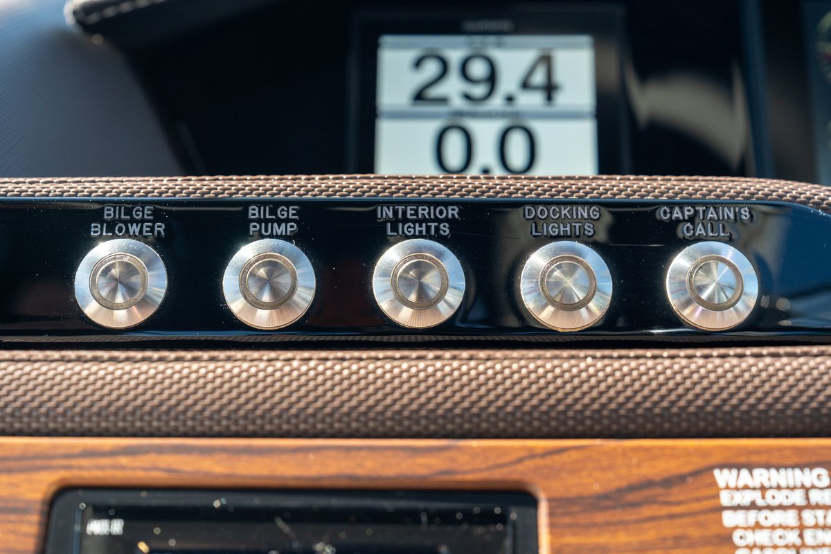 Cobalt R7 Surf boat dashboard with digital display and illuminated boat controls.