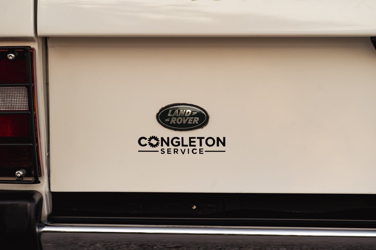 A white 1995 Land Rover Range Rover County with "Congleton Service" badging.