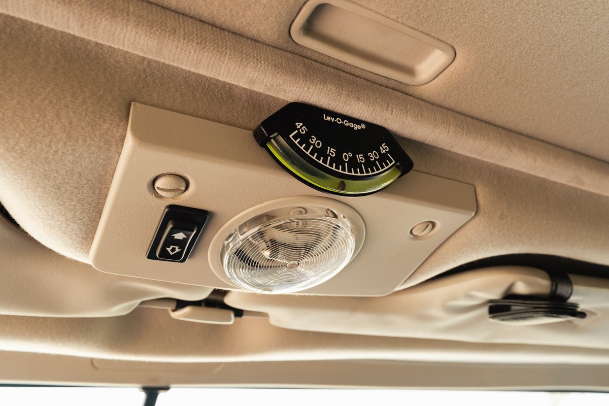 1995 white Land Rover Range Rover County dashboard inclinometer and dome light.