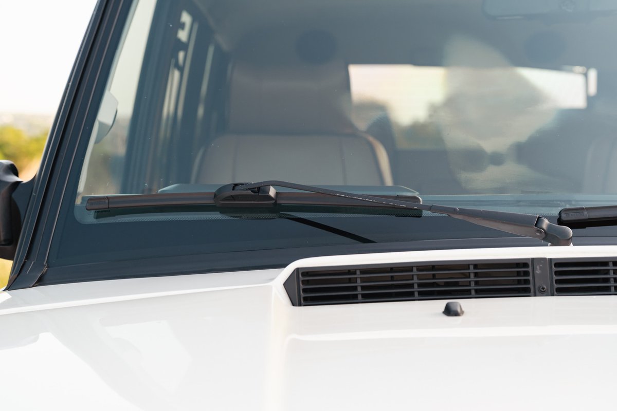 White 1995 Land Rover Range Rover County with wiper detail on windshield.