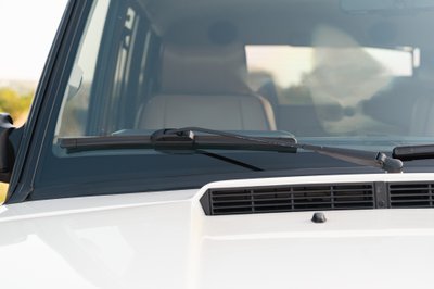 White 1995 Land Rover Range Rover County with wiper detail on windshield.