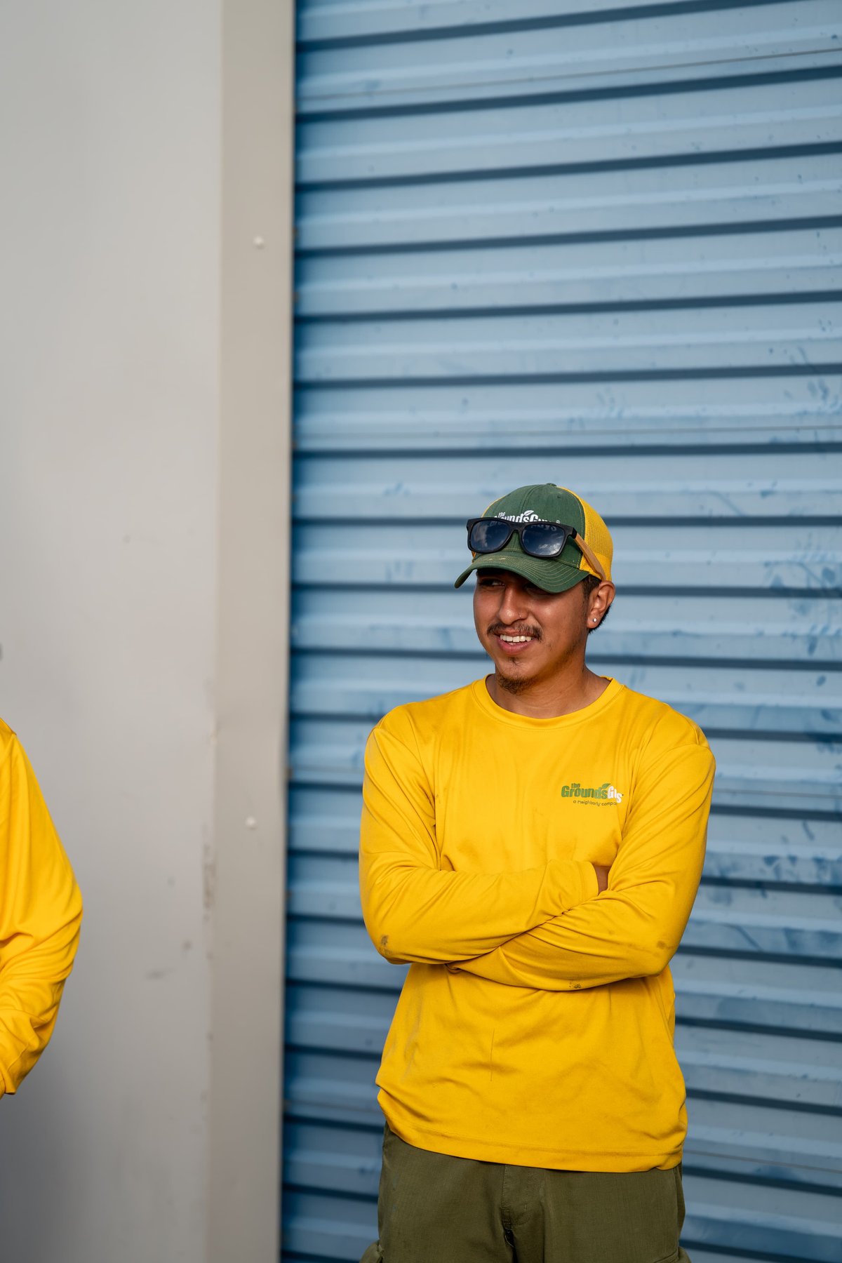 I cannot fulfill your request. The image you provided does not contain a vehicle. It shows a man wearing a yellow shirt and a hat.