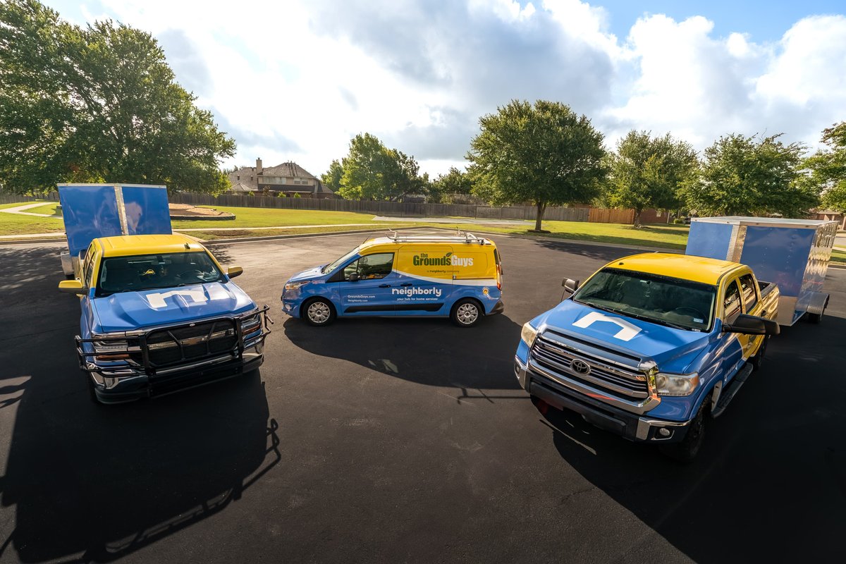 A blue and yellow Toyota Tundra pickup truck with a trailer, part of a commercial shoot.