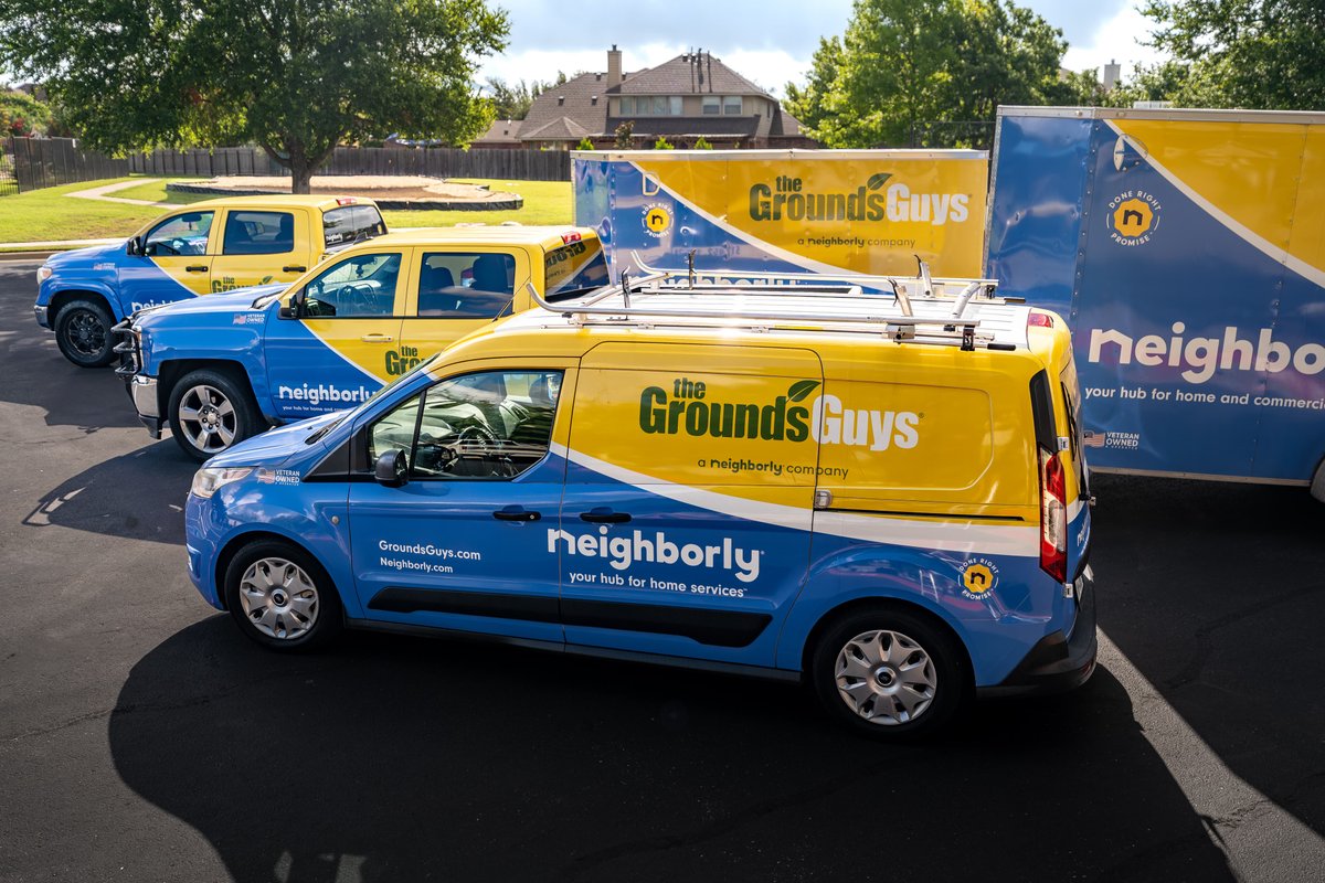 A blue and yellow Ford Transit Connect van with Neighborly livery, featuring silver rims.