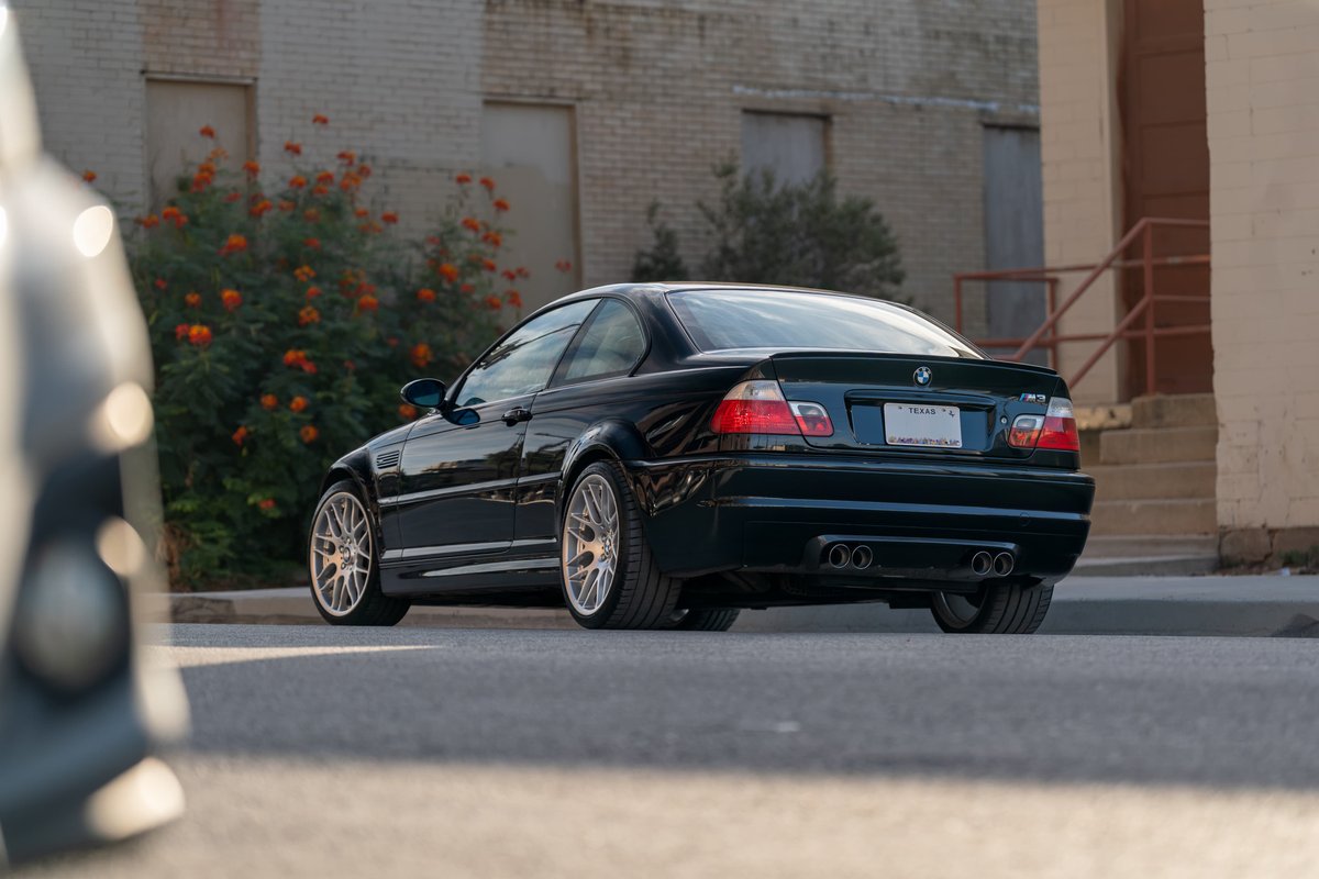 Carbon Black 2002 BMW M3 coupe with CSL rims and spoiler.