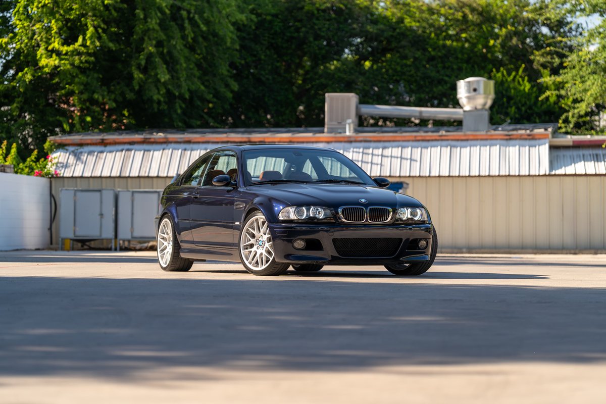 2002 BMW M3 in Carbon Black. Features silver multi-spoke rims and sleek, sporty body trim.