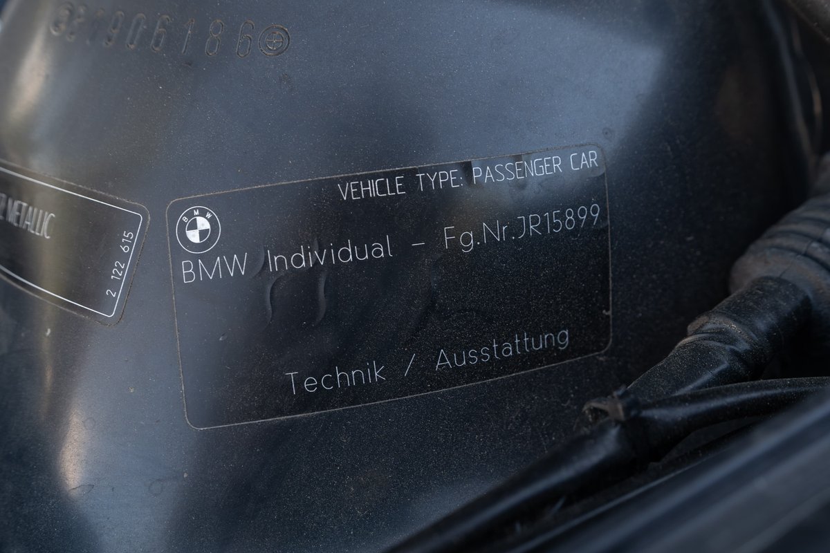 Close up of BMW Individual VIN sticker on a Carbon Black 2002 M3.