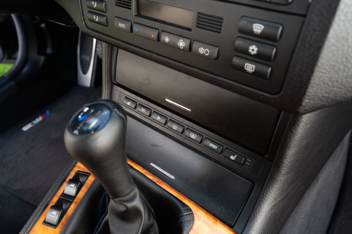 2002 BMW M3 carbon black interior. Manual shifter, heated seats, sport button, wood trim.