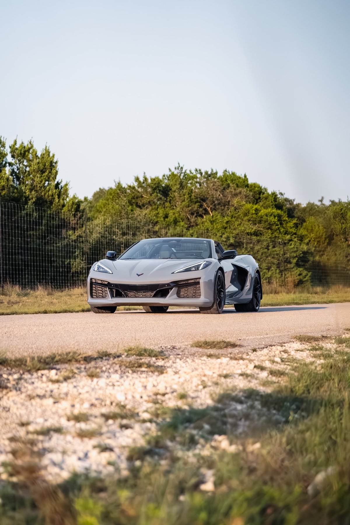 2025 Chevrolet Corvette Z06 in Sea Wolf Gray, front three-quarter view, dark rims.