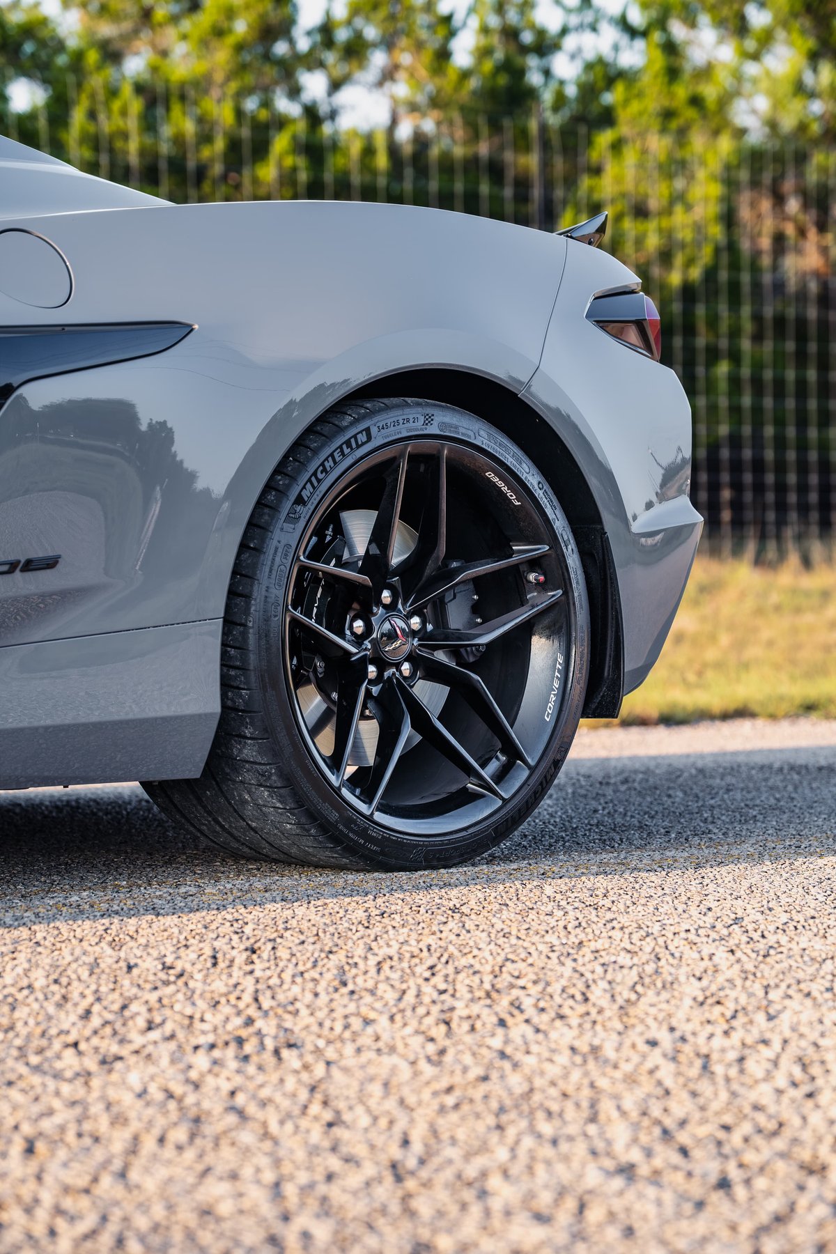 Sea Wolf Gray 2025 Chevrolet Corvette Z06 with gloss black multi-spoke rims and Michelin tires.