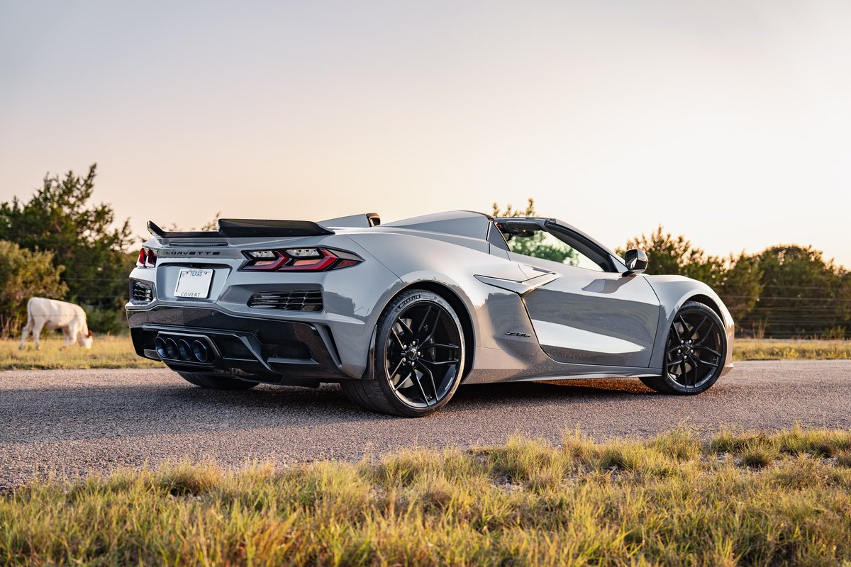 2025 Chevrolet Corvette Z06 convertible in Sea Wolf Gray with black rims and aero trim.