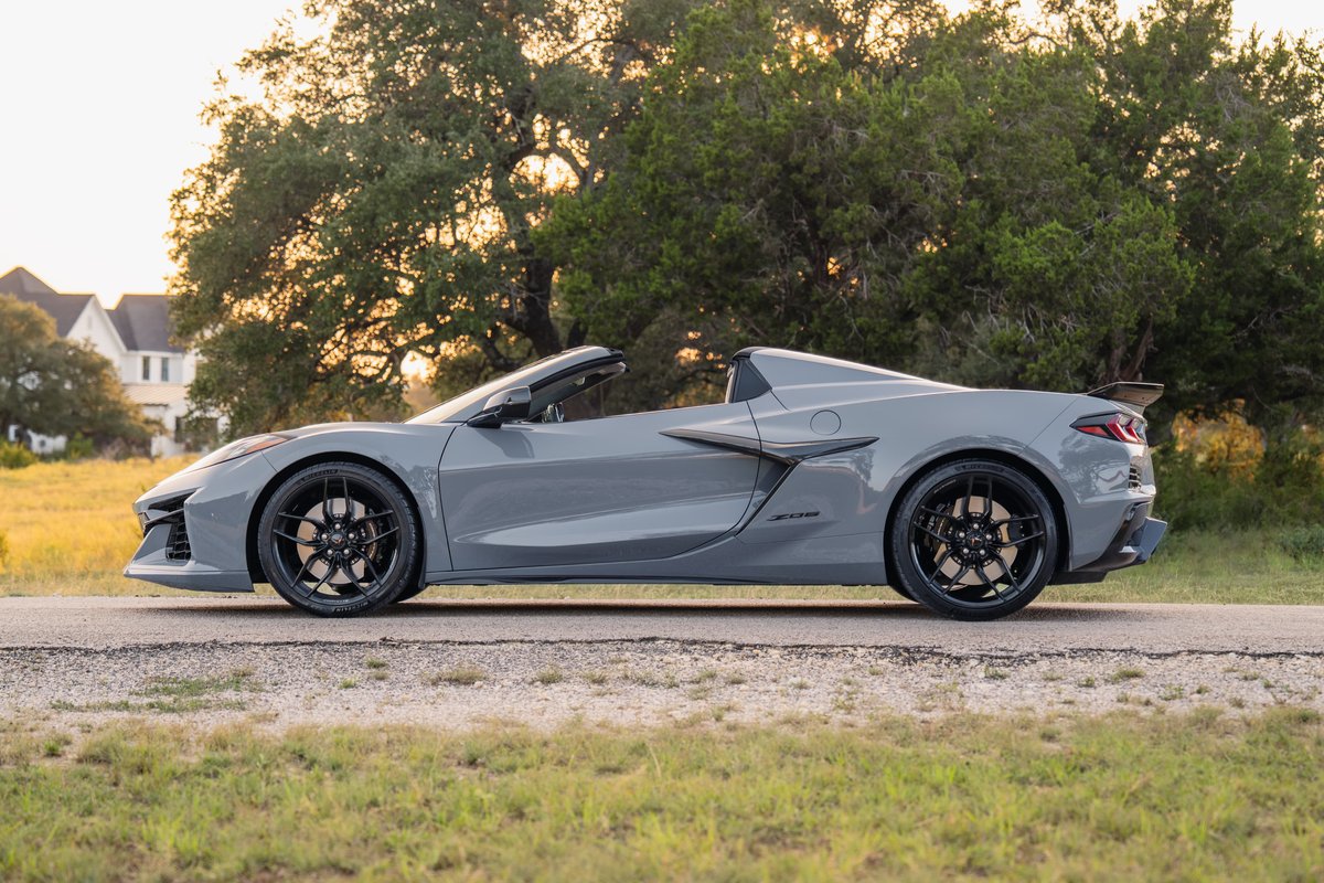 2025 Corvette Z06 convertible in Sea Wolf Gray with black rims and aero trim.