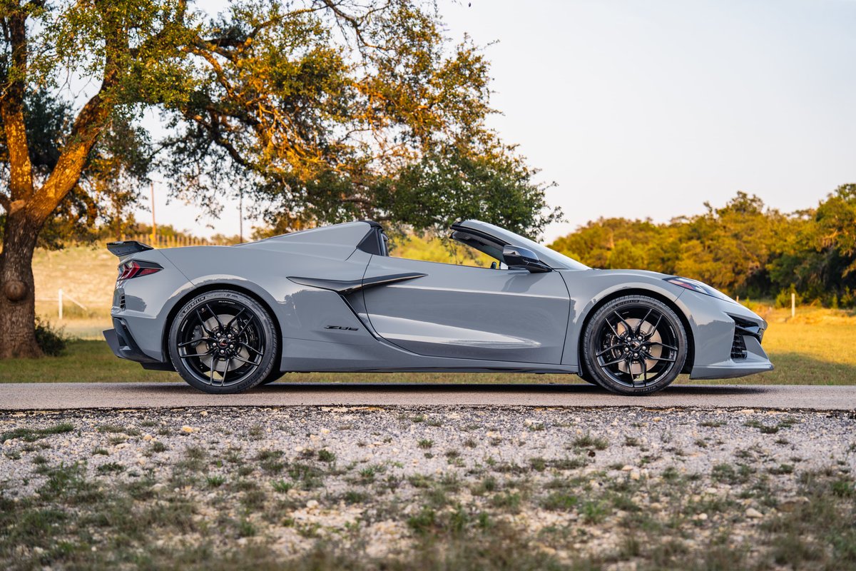2025 Chevrolet Corvette Z06 in Sea Wolf Gray, black rims, black spoiler.