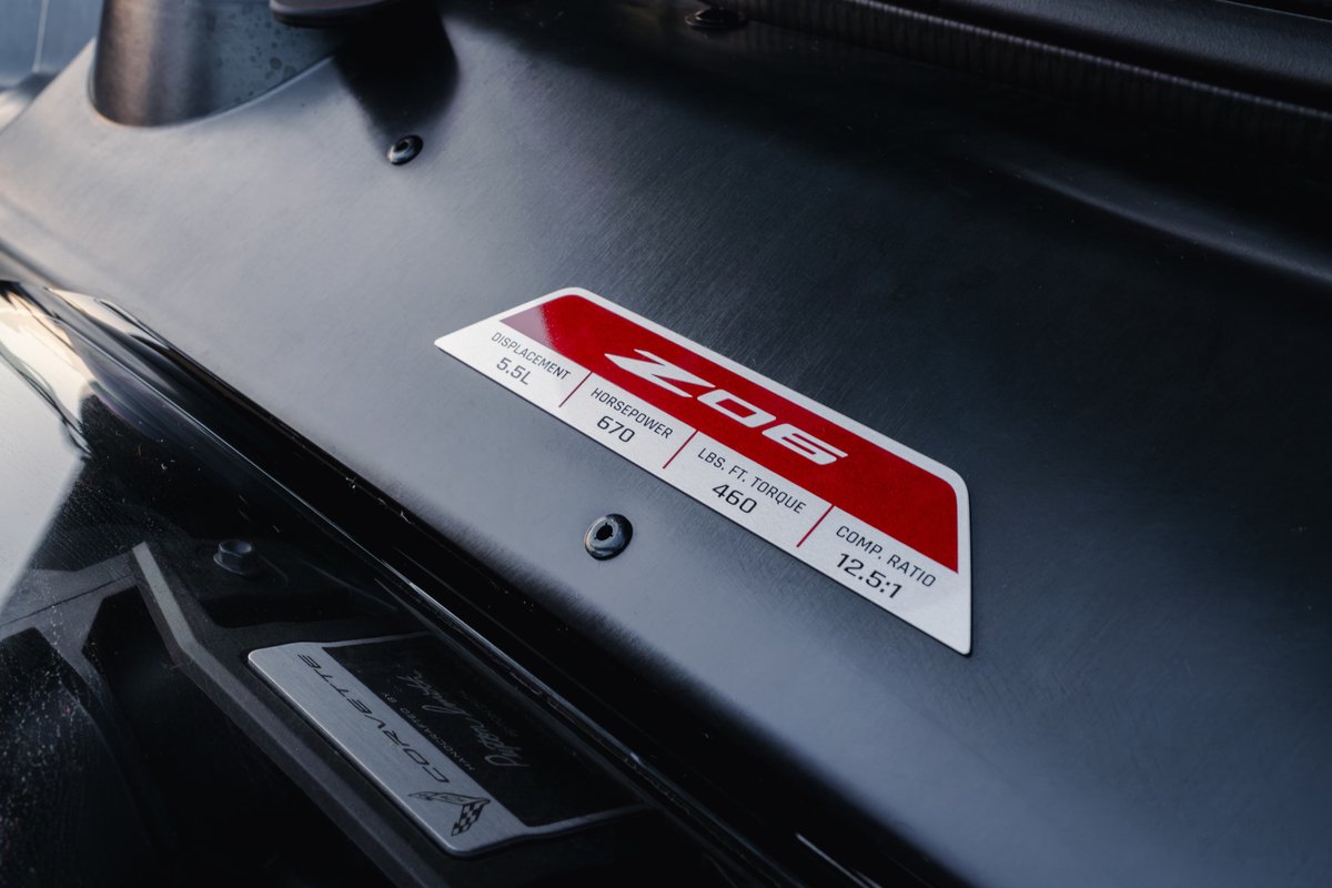 Close-up of a Sea Wolf Gray 2025 Chevrolet Corvette Z06 badge detailing 5.5L displacement, 670 hp, 460 lb-ft torque.