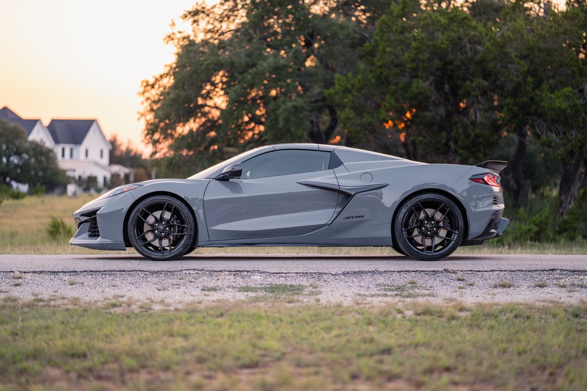 2025 Chevrolet Corvette Z06 in Sea Wolf Gray with black rims and wing.