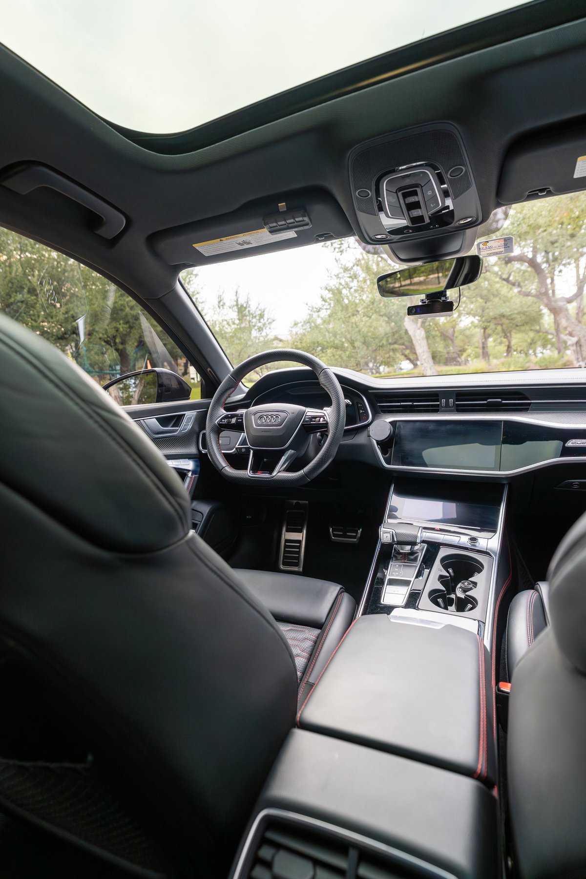 2022 Nardo Grey Audi RS6 interior with panoramic sunroof and touchscreen infotainment.