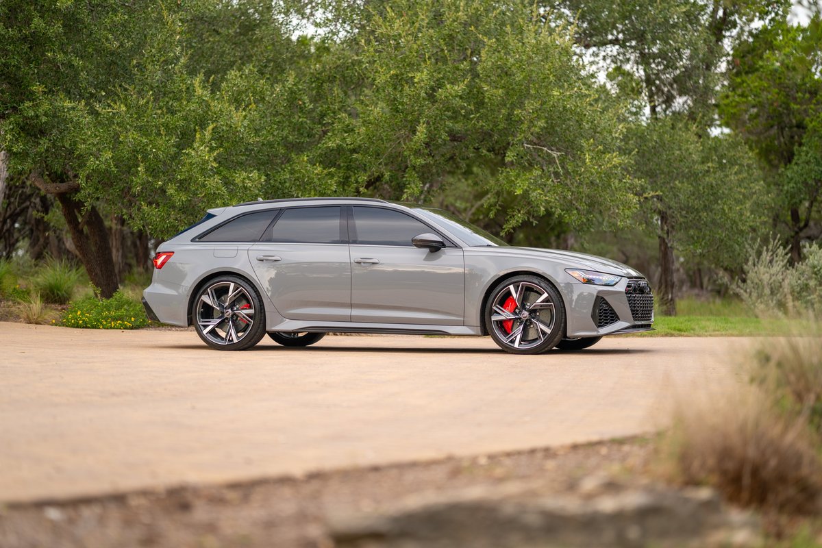 2022 Audi RS6 Avant in Nardo Grey, featuring performance rims with red brake calipers.