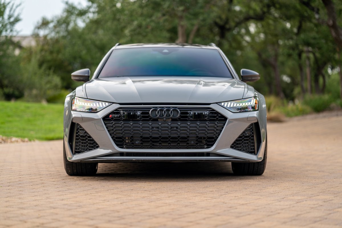 Nardo Grey 2022 Audi RS6 Avant front view with aggressive honeycomb grille and LED headlights.