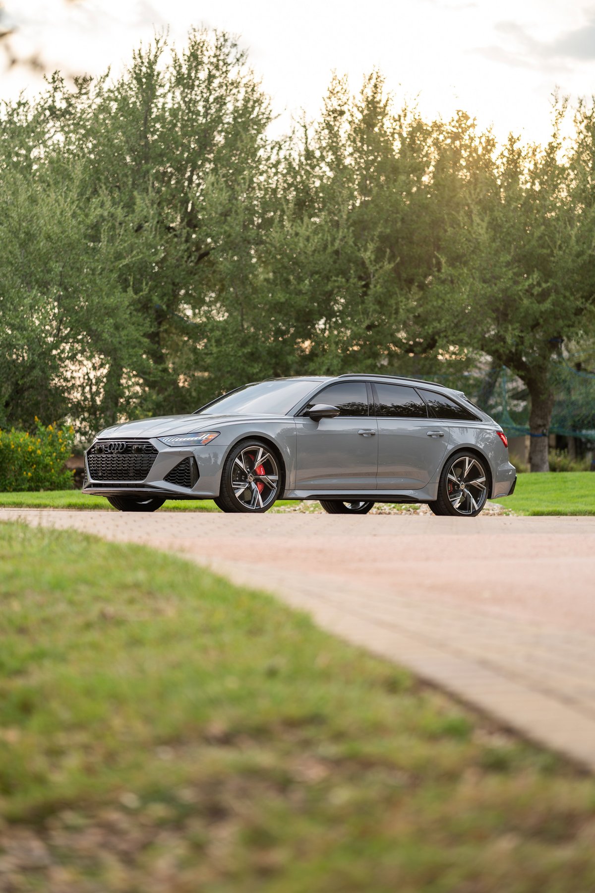 Nardo Grey 2022 Audi RS6 Avant with performance wheels and red brake calipers.