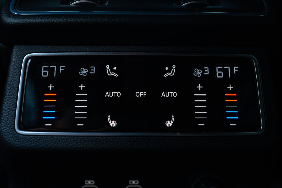2022 Audi RS6 Nardo Grey climate control panel with dual 67F temp, fan speed, and heated seat controls.