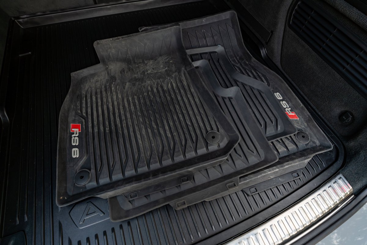 Black Audi RS6 all-weather floor mats with red RS 6 livery in Nardo Grey.