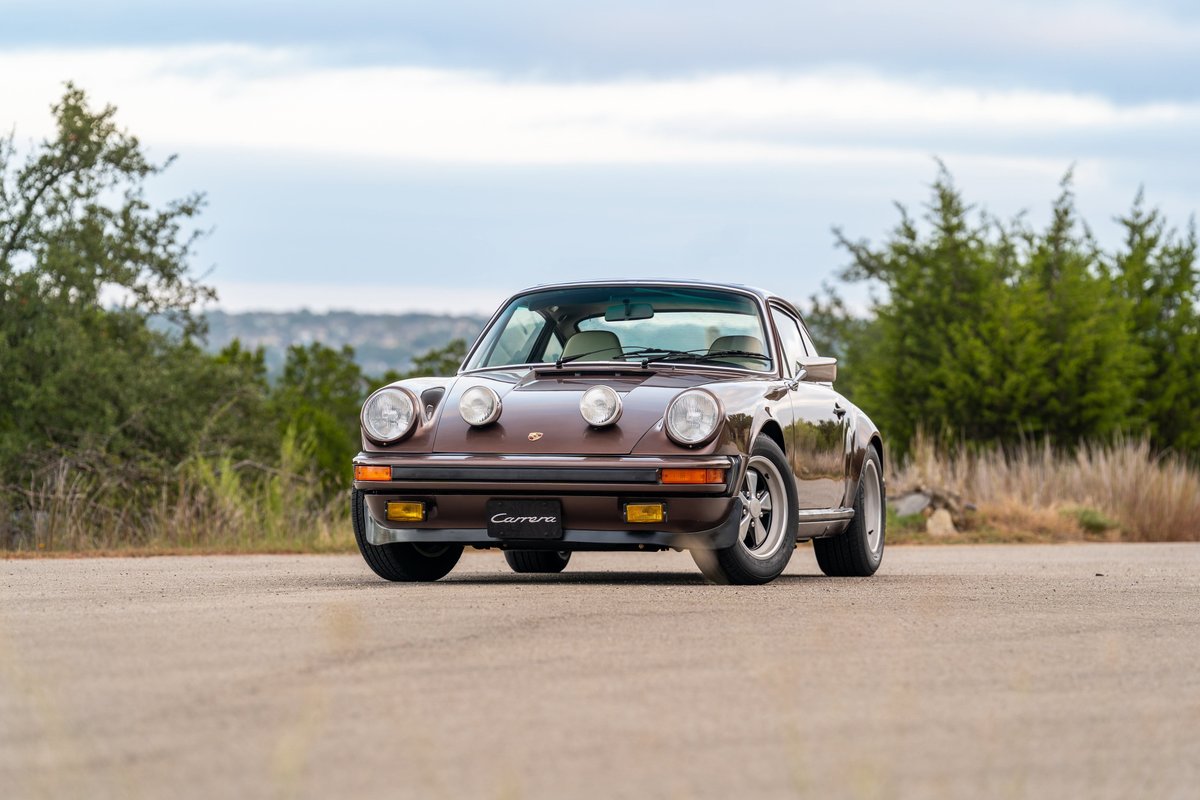 1975 Porsche 911 Carrera in Copper Brown Metallic, with fog lights and Fuchs rims.