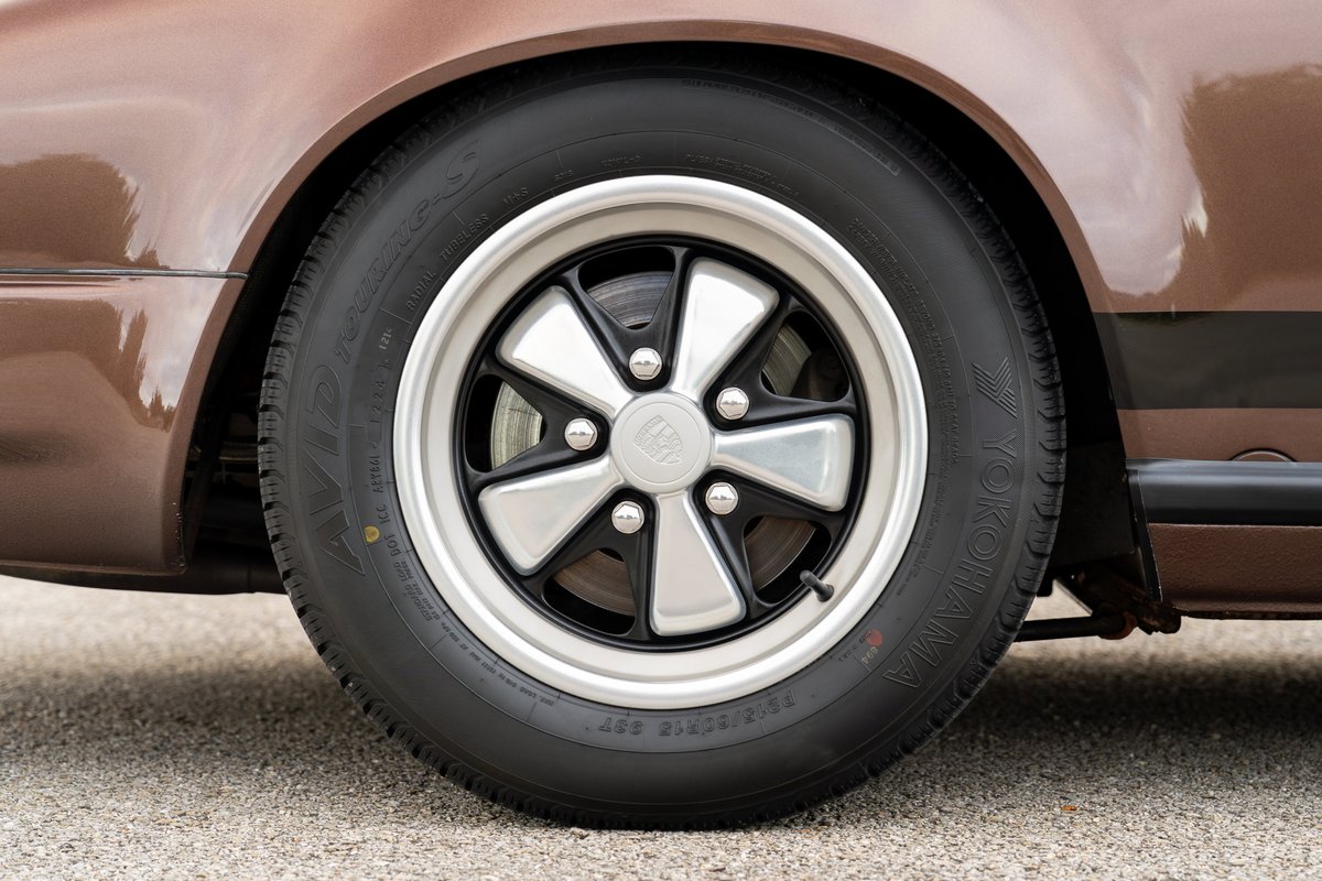 1975 Porsche 911 Carrera in Copper Brown Metallic with Fuchs rims.