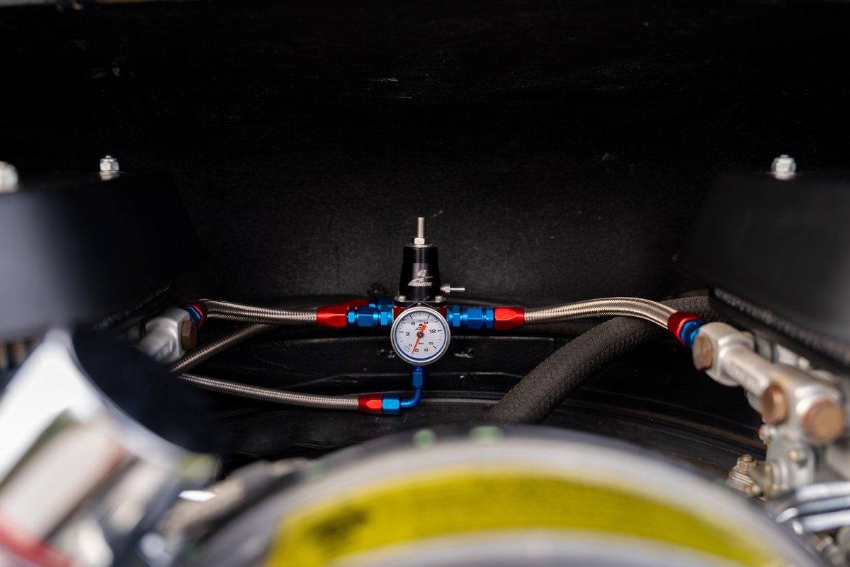 Custom fuel pressure regulator with gauge on a 1975 Porsche 911 Carrera engine.
