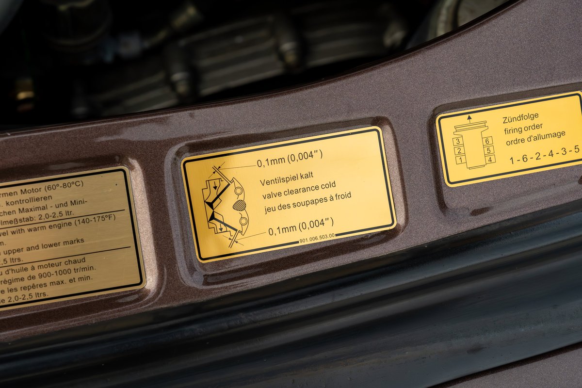 Gold engine bay decals on a 1975 Porsche 911 Carrera in Copper Brown Metallic.