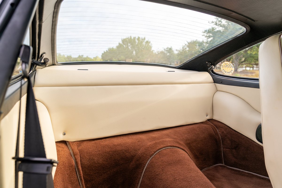 1975 Porsche 911 Carrera interior with cream leather trim & brown carpeting.