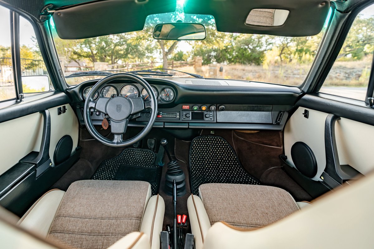 1975 Porsche 911 Carrera interior, brown metallic, beige & brown seats, classic dashboard.
