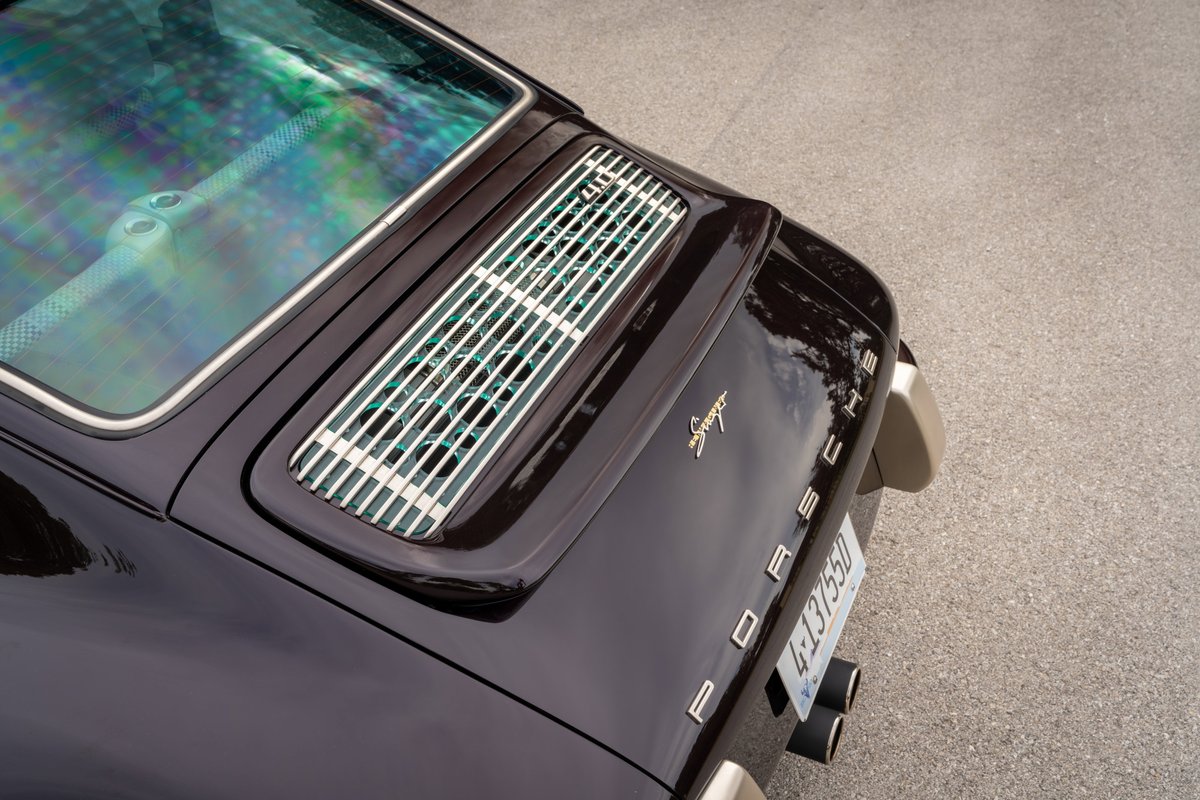 Aubergine metallic Singer 911 rear with chrome trim and exhaust pipes.